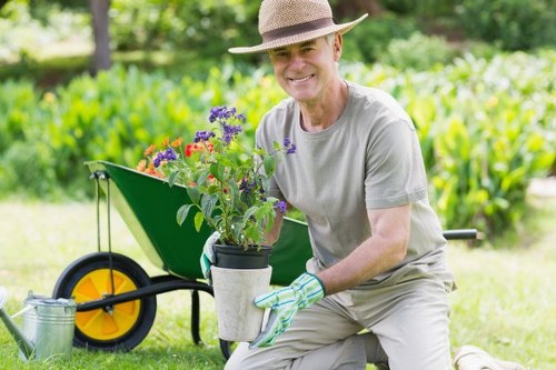 Professional landscaper maintaining a Kentish Town garden